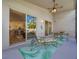 Bright screened porch features sliding glass doors to the interior at 4139 63Rd E Ter, Sarasota, FL 34243