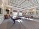 Game Room featuring two billiard tables and comfortable seating at 4139 63Rd E Ter, Sarasota, FL 34243