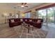 Living room with sectional sofa, hardwood floors, and access to screened patio at 4139 63Rd E Ter, Sarasota, FL 34243
