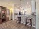 Bright kitchen with white cabinets, black appliances, and granite countertops at 4139 63Rd E Ter, Sarasota, FL 34243