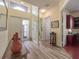 Bright and airy entryway with hardwood floors and a view to the home office at 4139 63Rd E Ter, Sarasota, FL 34243