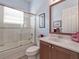 Clean bathroom with a tub shower combo and updated vanity at 4139 63Rd E Ter, Sarasota, FL 34243