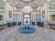 Elegant lobby with a large chandelier and comfortable seating at 4139 63Rd E Ter, Sarasota, FL 34243