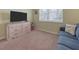 Bedroom with dresser, couch, and TV at 4139 63Rd E Ter, Sarasota, FL 34243
