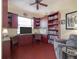 Spacious home office with built-in bookshelves and ample workspace at 4139 63Rd E Ter, Sarasota, FL 34243