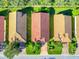 Three homes with terracotta roofs viewed from above at 4139 63Rd E Ter, Sarasota, FL 34243