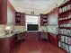 Home office with built-in cabinetry, hardwood floors, and comfortable seating at 4139 63Rd E Ter, Sarasota, FL 34243