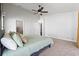 Bright and airy main bedroom with king-size bed and access to bathroom at 4818 61St Avenue W Ter, Bradenton, FL 34210