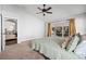 Large main bedroom with king-size bed and access to private bathroom at 4818 61St Avenue W Ter, Bradenton, FL 34210