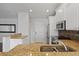 Modern kitchen with granite countertops and stainless steel appliances at 4818 61St Avenue W Ter, Bradenton, FL 34210