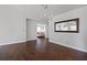 Dining room featuring hardwood floors and view into living room at 4818 61St Avenue W Ter, Bradenton, FL 34210