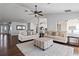Bright living room with hardwood floors, comfy seating and large windows at 4818 61St Avenue W Ter, Bradenton, FL 34210