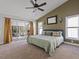 Spacious main bedroom with king-size bed and sliding doors to backyard at 4818 61St Avenue W Ter, Bradenton, FL 34210