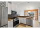 Updated kitchen with granite countertops, stainless steel appliances, and breakfast bar at 4818 61St Avenue W Ter, Bradenton, FL 34210