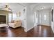 Bright entryway with hardwood floors and views into living room and built-in shelving at 4818 61St Avenue W Ter, Bradenton, FL 34210