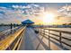 Peaceful waterfront dock at sunset, leading to a waterfront restaurant at 4818 61St Avenue W Ter, Bradenton, FL 34210
