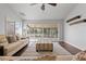 Living room with hardwood floors, sliding glass doors, and neutral decor at 4818 61St Avenue W Ter, Bradenton, FL 34210