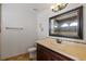 Bathroom with vanity, toilet, and large mirror at 4818 61St Avenue W Ter, Bradenton, FL 34210
