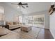 Living area featuring hardwood floors, sliding glass doors, and comfy seating at 4818 61St Avenue W Ter, Bradenton, FL 34210