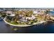 Aerial view of waterfront home with pool and private dock at 543 Key Royale Dr, Holmes Beach, FL 34217