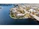An aerial view of a waterfront home with a pool and dock at 543 Key Royale Dr, Holmes Beach, FL 34217
