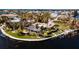 Aerial view of waterfront home featuring a pool and dock at 543 Key Royale Dr, Holmes Beach, FL 34217