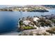 Aerial view of a waterfront home with pool and dock access at 543 Key Royale Dr, Holmes Beach, FL 34217