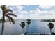 Stunning view of water, sky, and palm trees at 543 Key Royale Dr, Holmes Beach, FL 34217