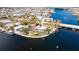 Aerial view showcasing waterfront home, pool, and dock at 543 Key Royale Dr, Holmes Beach, FL 34217