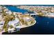 High-angle view of waterfront house, pool, and boat dock at 543 Key Royale Dr, Holmes Beach, FL 34217
