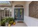 Elegant front entry featuring double doors and a decorative screen at 8223 Regents Ct, University Park, FL 34201