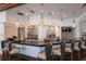 Upscale community bar with a modern design, pendant lighting, and ample seating at 8223 Regents Ct, University Park, FL 34201