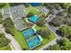 Aerial view of tennis and pickleball courts with a central pavilion at 8223 Regents Ct, University Park, FL 34201