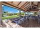 Relaxing outdoor lounge area with comfortable seating and beautiful views at 8223 Regents Ct, University Park, FL 34201