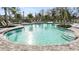 Resort-style pool with plenty of lounge chairs and umbrellas at 15084 Shady Palms Ln, Nokomis, FL 34275