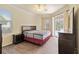 This bedroom has hardwood floors, neutral walls, and a sliding glass door at 115 Winding River Trl, Bradenton, FL 34212