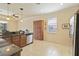 Modern kitchen with granite countertops, stainless steel appliances, and a breakfast bar at 115 Winding River Trl, Bradenton, FL 34212