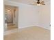 The living room features tile floors, a ceiling fan, and a view to the entryway at 115 Winding River Trl, Bradenton, FL 34212