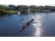 Aerial view of rowing team on sparkling lake at 251 Okeeffe Cir, Bradenton, FL 34212