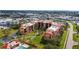 Aerial view showcasing the community, its manicured grounds, and proximity to shopping and services at 3006 Caring Way # 224, Port Charlotte, FL 33952