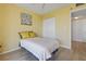 Bright bedroom with a large closet and an adjacent bathroom at 3006 Caring Way # 224, Port Charlotte, FL 33952