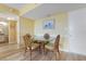 Cozy dining area with a glass-top table and seating for four, perfect for intimate meals at 3006 Caring Way # 224, Port Charlotte, FL 33952