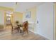 Bright dining area with seating for four, next to the entrance door at 3006 Caring Way # 224, Port Charlotte, FL 33952