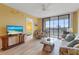 Cozy living room with natural light, a comfortable seating area, and easy access to the balcony at 3006 Caring Way # 224, Port Charlotte, FL 33952