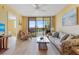 Bright living room with access to a balcony, offering a seamless transition to outdoor living at 3006 Caring Way # 224, Port Charlotte, FL 33952