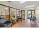 Inviting lobby area with brick flooring, comfortable seating, and glass-enclosed community spaces at 3006 Caring Way # 224, Port Charlotte, FL 33952