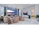 Spacious living room with ocean view, featuring comfortable seating and modern decor at 4651 Gulf Of Mexico Dr # 402, Longboat Key, FL 34228