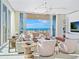 Bright living room with ocean views and comfy seating at 4651 Gulf Of Mexico Dr # 402, Longboat Key, FL 34228