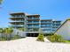 Modern building with landscaped grounds at 4651 Gulf Of Mexico Dr # 402, Longboat Key, FL 34228