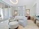 Spacious bedroom with large windows and sitting area at 4651 Gulf Of Mexico Dr # 402, Longboat Key, FL 34228
